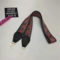 Detail of ethnic jacquard purse strap with gold hooks and black leather ends - Dandelion