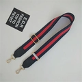 Detail of adjustable ethnic style striped strap with golden metal lobster clasps - Blue-Red-Blue Stripe