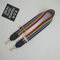 Detail view of rainbow striped woven bag strap with adjustable gold-tone metal buckles - Colorful Stripes Black