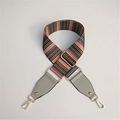 Close-up of colorful striped wide handbag strap with gold metal hooks and gray leather - Gray