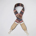 Detail of adjustable colorful striped bag strap with gold hooks and leather ends - Khaki