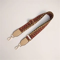 Detail of adjustable woven handbag strap with colorful geometric pattern and gold buckles - Dark with Beige