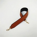 Detail view of brown PU leather shoulder strap with gold metal hooks and black backing - Brown