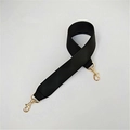 Macro shot of wide black PU leather replacement strap with gold metal swivel hooks - Black