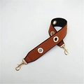 Close-up of brown PU leather shoulder strap with gold eyelets and metal lobster clasps - Brown