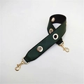 Detailed view of dark green PU leather shoulder strap with golden metal eyelets and clips - Green