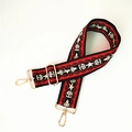 Bandoulière tissée style ethnique avec motifs géométriques rouge et noir et boucles dorées - Style Polyvalent Boucle Dorée
