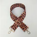 Detail of adjustable leopard print bag strap with golden metal swivel hooks and buckle - Dark Leopard Print
