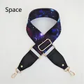 Detail of adjustable space pattern wide bag strap with golden metal lobster clasps - Space