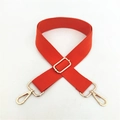 Detail of adjustable orange woven shoulder strap with polished gold metal lobster clasps - Orange