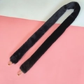 Close-up of black faux fur bag strap with golden metal carabiners and thick plush texture - Black
