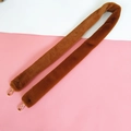 Detailed view of plush faux fur handbag strap in dark brown with golden metal lobster clasps - Brown