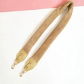 Detail of camel faux fur shoulder strap with golden lobster clasps and PU leather ends - Khaki