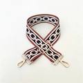 Close-up of adjustable ethnic crossbody strap with golden metal clasps and chain pattern - Brown Ring Pattern With Gold Buckle