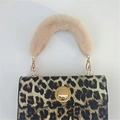 Stylish leopard print handbag with pink faux fur handle and gold circular metal buckle - Khaki