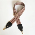 Detail of adjustable wide bag strap with brown and white chevron pattern and gold hooks - Khaki Strap with Black End