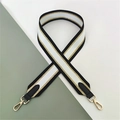 Detail of wide black white and gold striped replacement bag strap with metal lobster clasps - Black Silver Line with Black Leather (Silver Buckle)