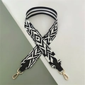 Close-up of ethnic geometric black and white woven shoulder strap with gold lobster clasps - Black Rainbow with Black Leather (Silver Buckle)