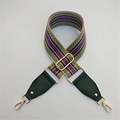 Detail showing colorful striped woven strap with green leather ends and gold metal hooks - Yellow & Green