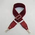 Macro view of wide red and black patterned woven strap with gold metal buckles - Red & Wine Red