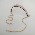 Detail of pink PU leather shoulder strap pad with golden metal chain links and lobster clasps - 120cmx2.2cm / Pink