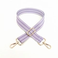 Detail of a wide woven purse strap with purple and white geometric patterns and gold clips - Light Purple