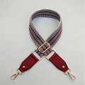 Detail of adjustable wide woven bag strap with red and white chevron pattern and gold hooks - 3.8cm Wide / Coffee + Wine Red
