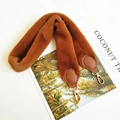 Detailed view of plush brown faux rabbit fur shoulder strap with gold metal lobster clasps - Brown
