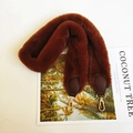 Detail of dark brown faux fur shoulder strap with golden metal lobster clasps - Brown