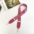 Close-up of adjustable striped wide shoulder strap with golden metal lobster clasps - Rose Red