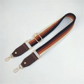 Detail of adjustable boho striped woven bag strap with leather ends and gold metal clips - Coffee (Style 3)