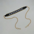 Detail of b&w geometric interlocking pattern strap with gold chain and lobster clasps - No.15 Chain Pattern