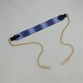 Dettaglio tracolla in tessuto con motivi geometrici blu rosa e catena dorata - N. 14 Strisce Blu