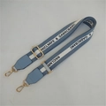 Detail of adjustable blue and white striped bag strap with gold metal hooks - Light Blue