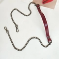 Macro detail of wine red leather shoulder pad and dark grey metal chain with lobster clasps - Plain Burgundy + Gunmetal Chain