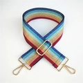 Close-up of rainbow striped woven bag strap with metallic shimmer and gold buckles - Multicolor Rainbow