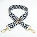 Detail view of the black and white geometric woven strap with golden metal lobster clasps - Silver Clasp / No. 15 Black