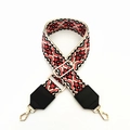 Detail of ethnic geometric bag strap with red and black patterns and gold buckles - Beige Floral With Black Leather