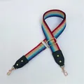 Close-up of adjustable colorful striped bag strap with glitter texture and gold metal hooks - Green