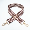 Close-up of ethnic woven pattern bag strap with golden metal hooks and adjustable buckle - No.12 Contrast Brown White