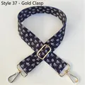 Detail of wide black strap with white letter pattern and adjustable gold metal buckle - Style 37 - Gold Buckle