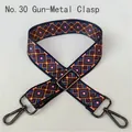 Close-up of ethnic geometric pattern webbing strap with gunmetal swivel hooks and buckle - No. 30 Gunmetal Buckle