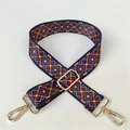 Close-up of geometric woven strap with gold metal swivel hooks and adjustment buckle - No. 30 Gold Buckle