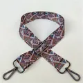 Close-up of geometric ethnic bag strap with dark grey metal lobster clasps and buckles - No. 31 Gunmetal Buckle