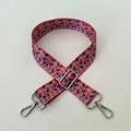 Close-up of floral canvas bag strap with silver metal buckles and No. 92 pattern - No. 92 Silver Buckle