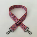 Detail of floral canvas bag strap featuring colorful patterns and gunmetal swivel hooks - No. 92 Gunmetal Buckle