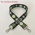 Close-up of ethnic style embroidered bag strap with floral pattern and silver buckle - No. 82 / Silver