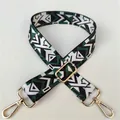 Detail of adjustable wide shoulder strap featuring ethnic green geometric patterns and gold buckles - No. 32 Gold Buckle