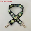 Close-up of ethnic style wide fabric shoulder strap with floral pattern and gold metal hooks - No. 82 / Gold