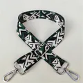Macro detail of geometric ethnic strap pattern with silver lobster clasp and slider - No. 32 Silver Buckle